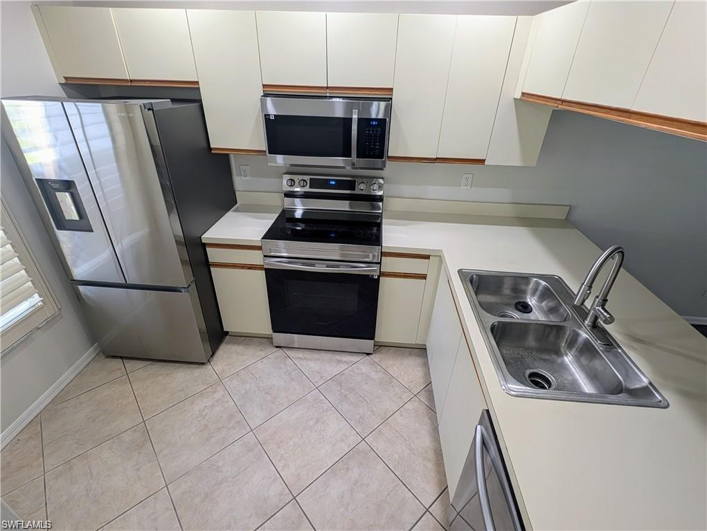 Kitchen features newer stainless steel appliances