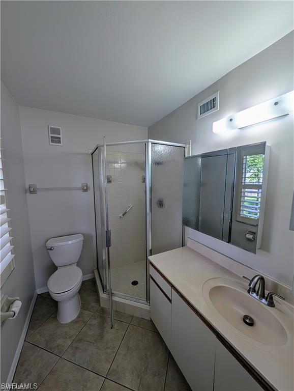 Full bathroom with large vanity and walk in shower