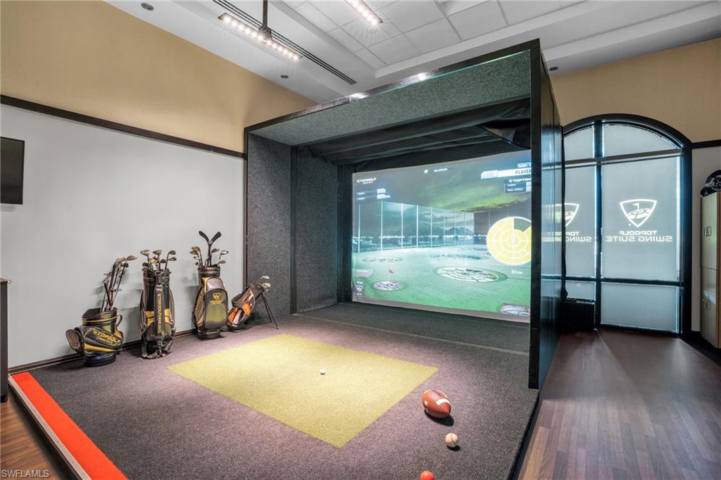 Playroom featuring golf simulator