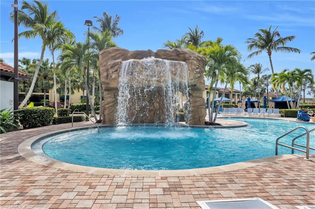 Community pool featuring a patio