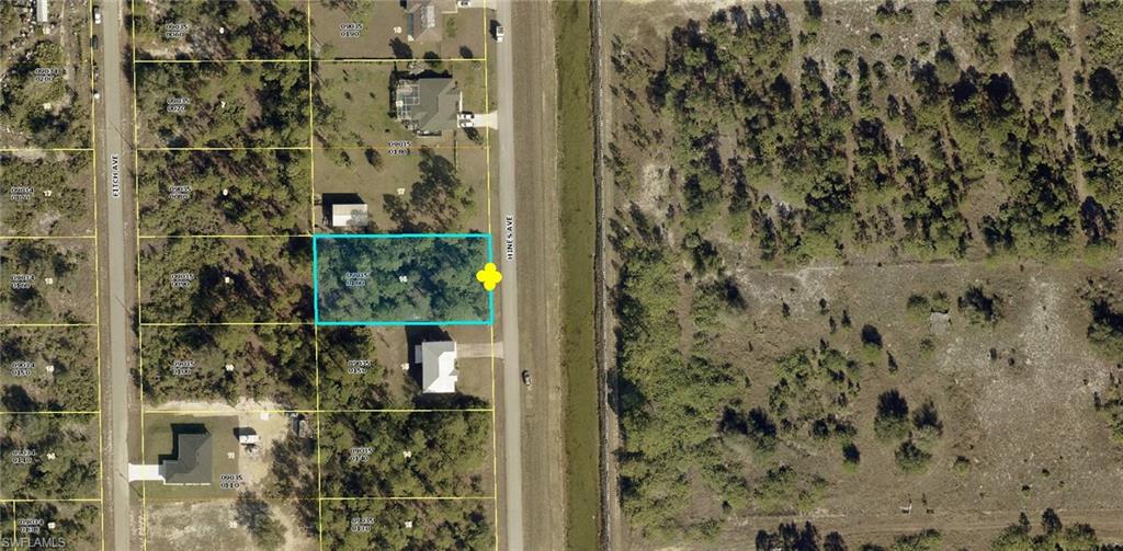 Aerial overview of property's location featuring property parcel outlined