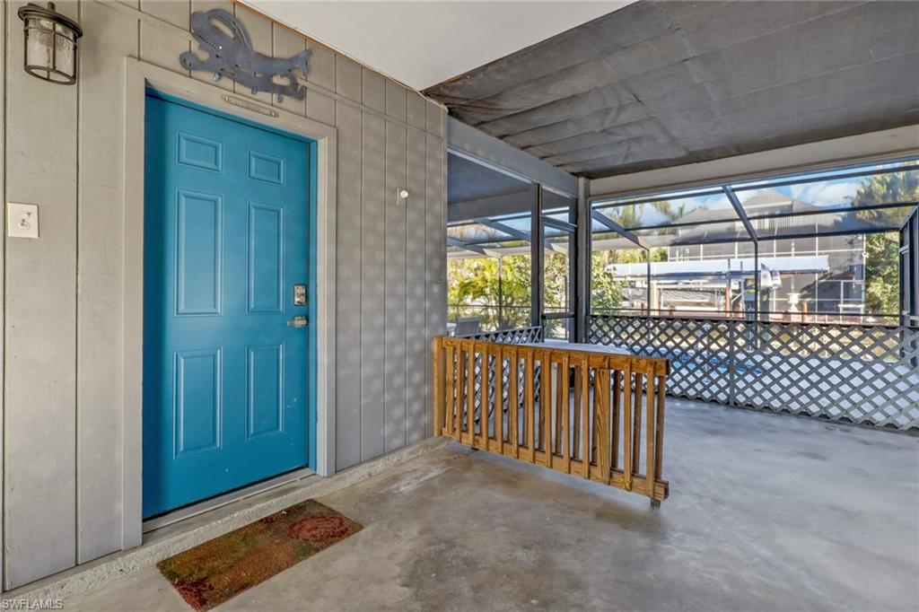 1/1 Efficiency- Doorway to property featuring a sunroom and a patio