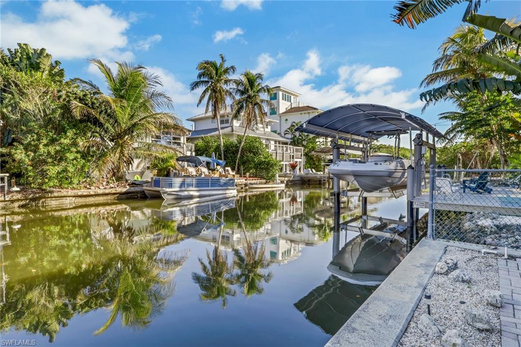 Dock with boat lift and a water view