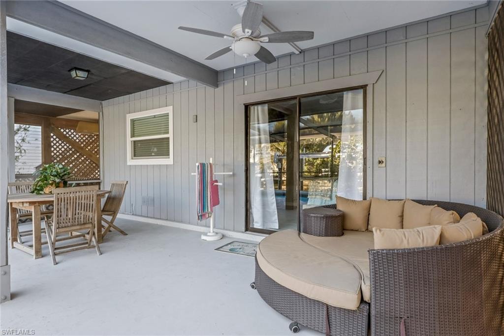 View of patio featuring ceiling fan, outdoor dining space, and outdoor lounge area