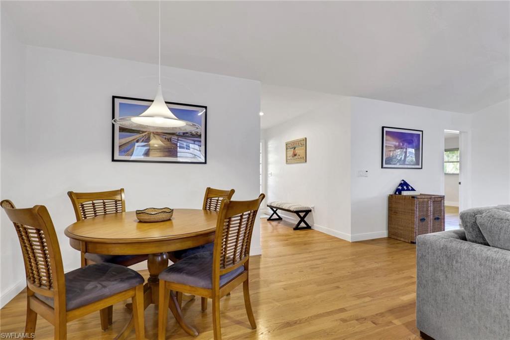 Dining room with light wood-style floors and baseboards