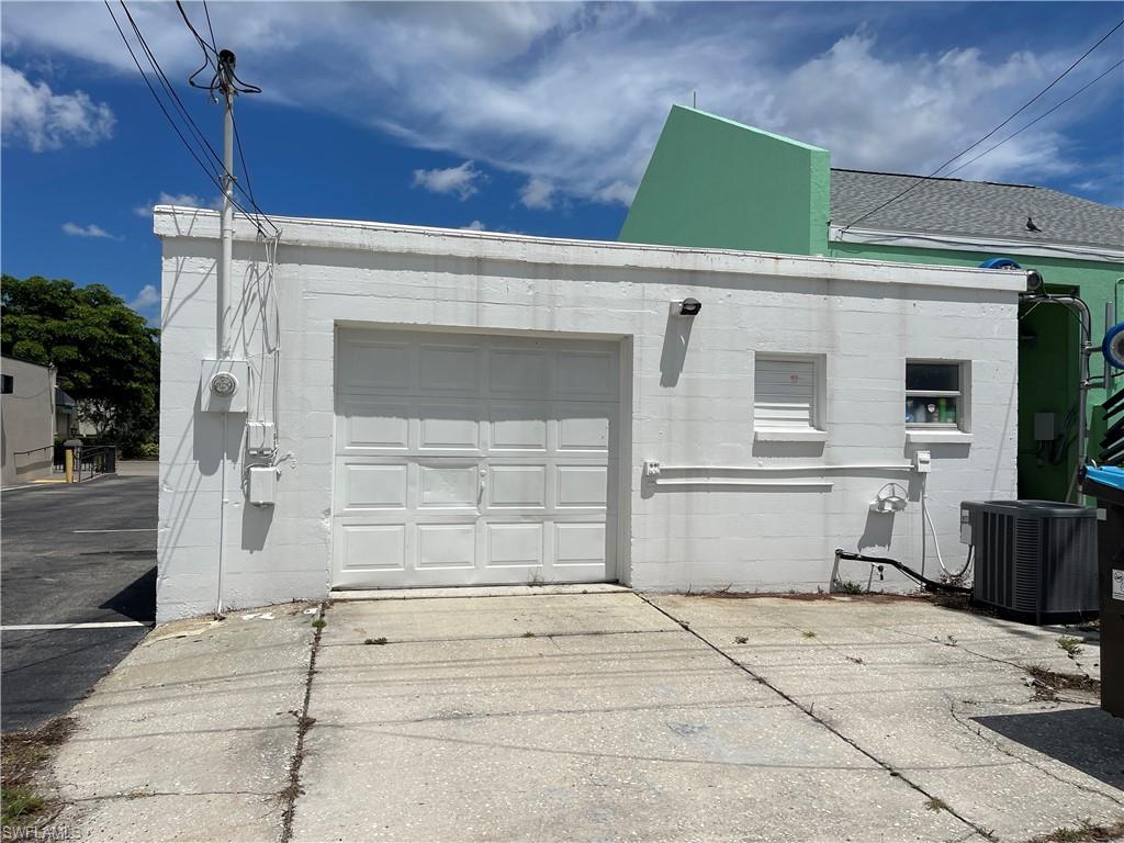 Garage with concrete driveway