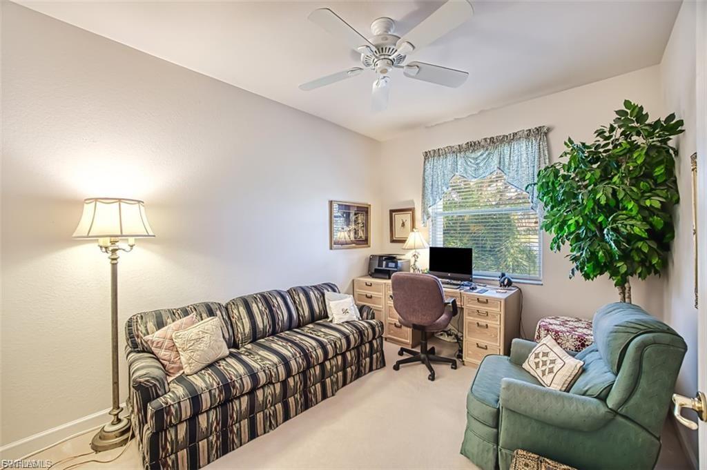 Office space featuring carpet floors and ceiling fan