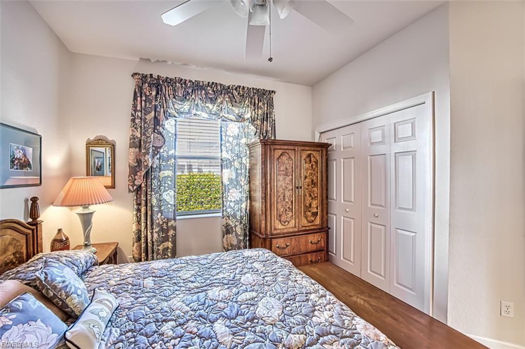 Bedroom featuring a closet, wood finished floors, and a ceiling fan