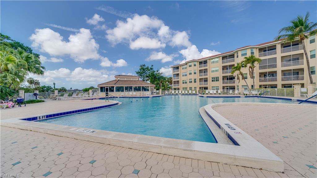 Community pool featuring a patio