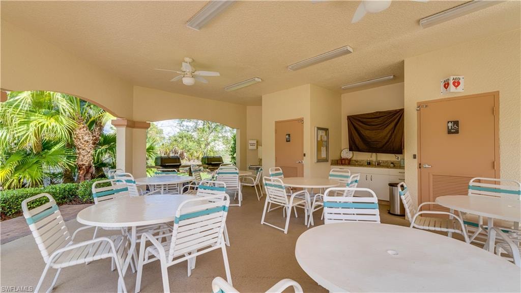 View of patio / terrace featuring outdoor dining space and a ceiling fan