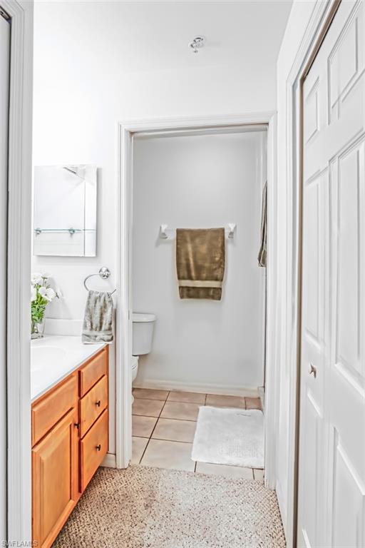 Bathroom with vanity and light tile patterned flooring