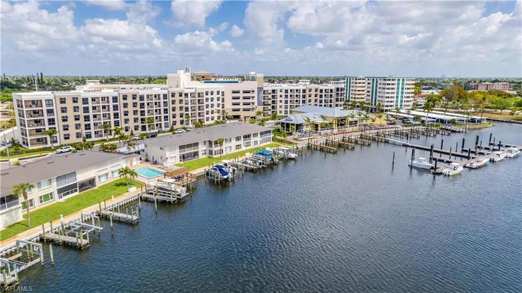 Drone / aerial view of a marina and a nearby body of water