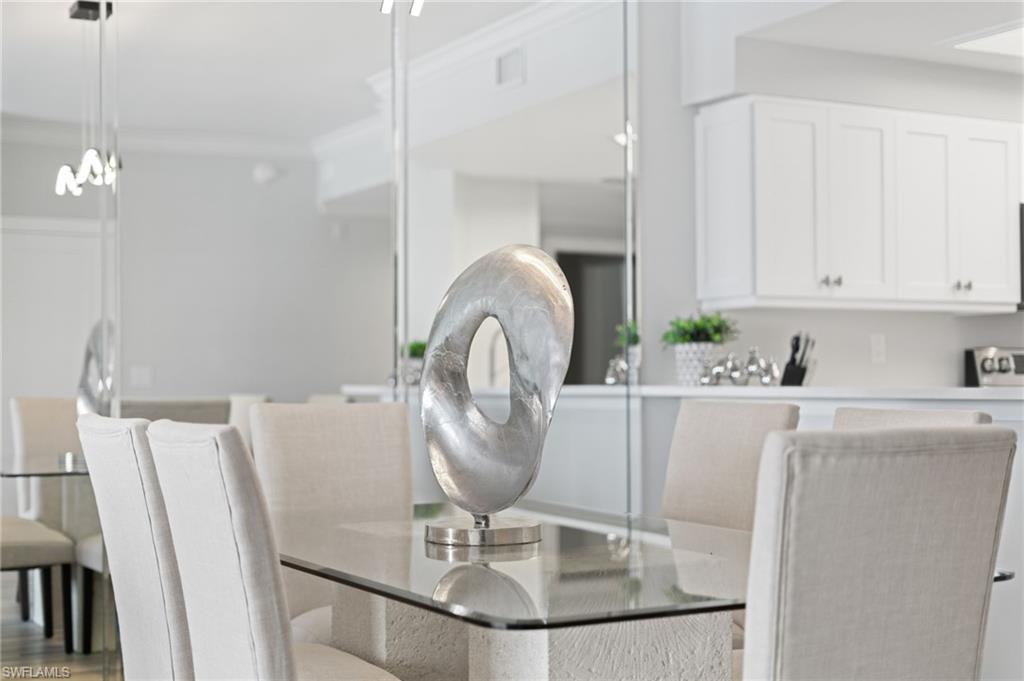 Dining space featuring ornamental molding