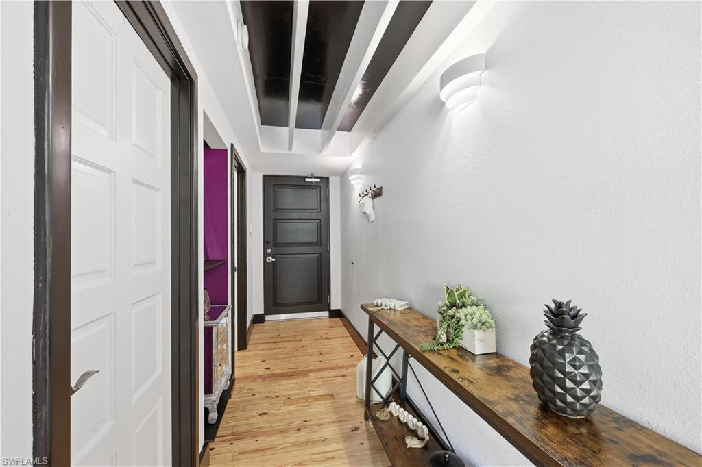 Entryway with hardwood / wood-style floors