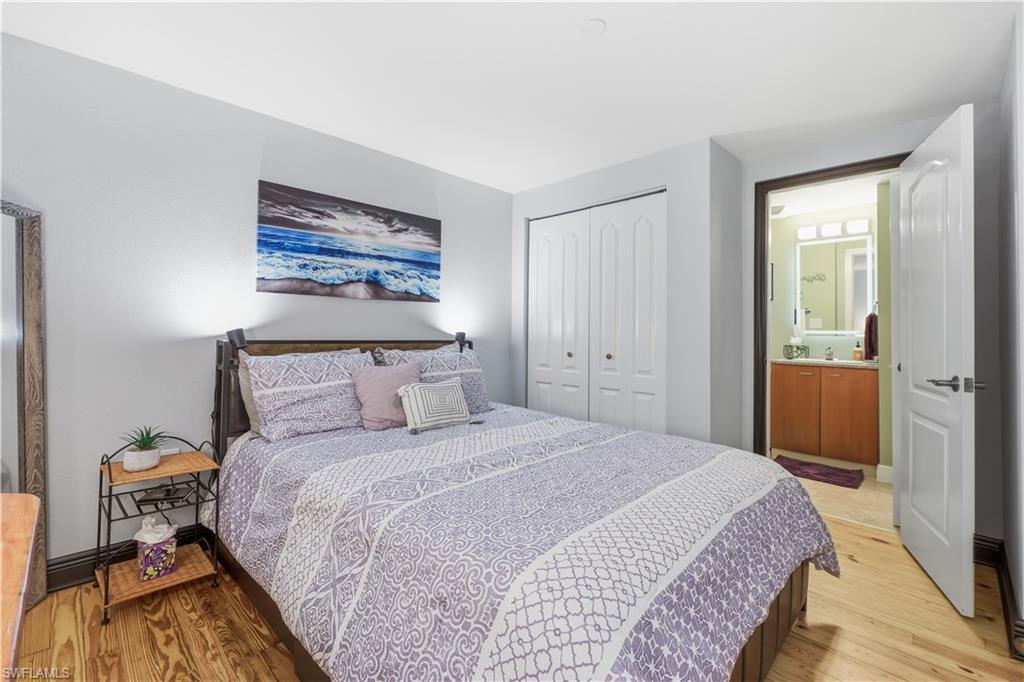 Guest Bedroom with a closet and light wood-style floors