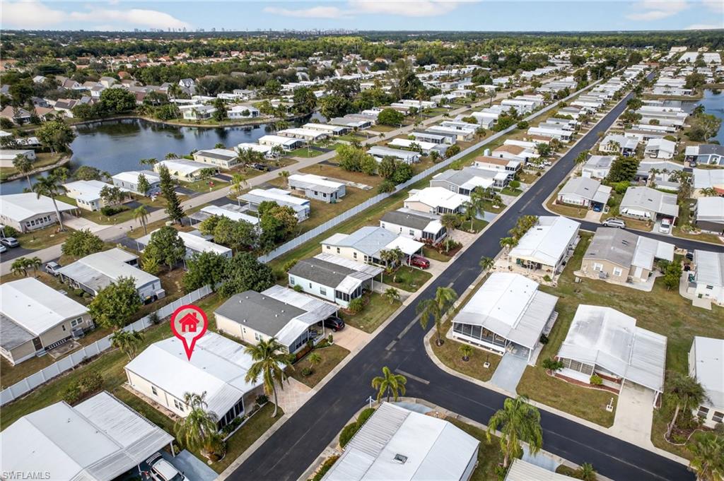 View of property location featuring nearby suburban area and a nearby body of water