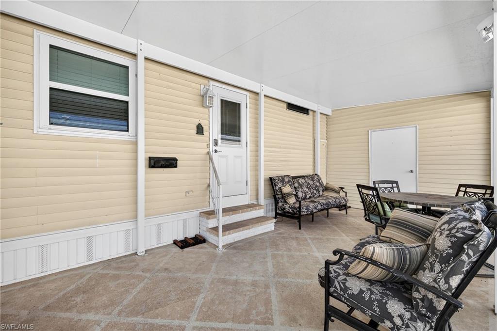 View of patio / terrace with entry steps and outdoor dining area