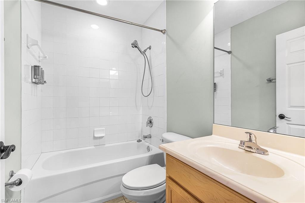 Full bath featuring vanity and shower / washtub combination