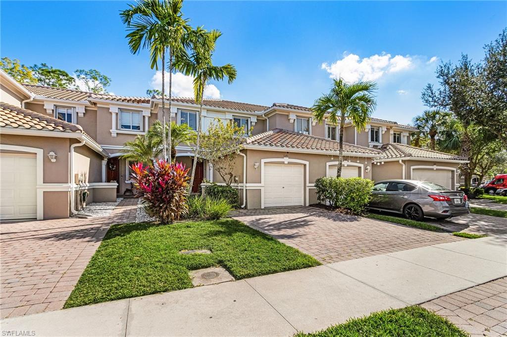 Mediterranean / spanish home with stucco siding, decorative driveway, and a tiled roof