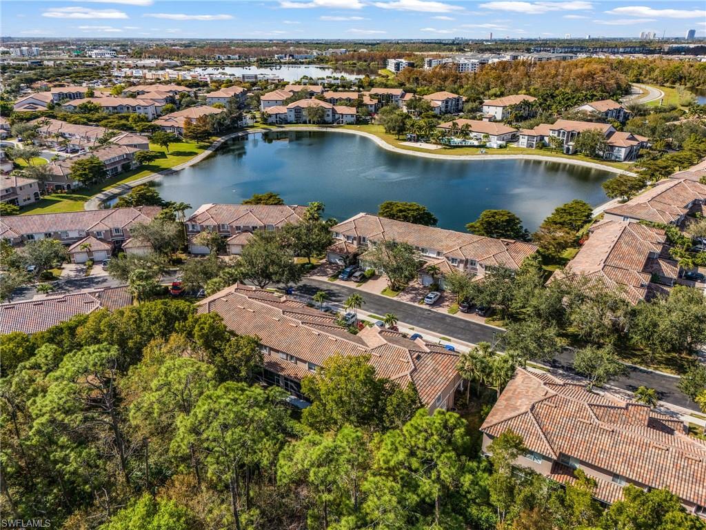View of property location with nearby suburban area and a nearby body of water