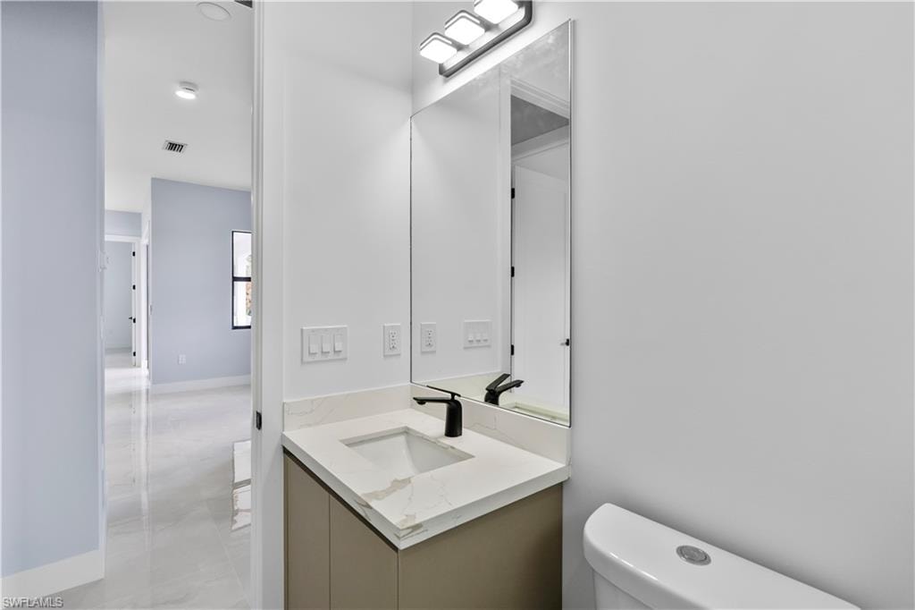 Bathroom with toilet and vanity