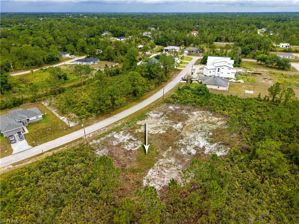 Aerial overview of property's location featuring a heavily wooded area