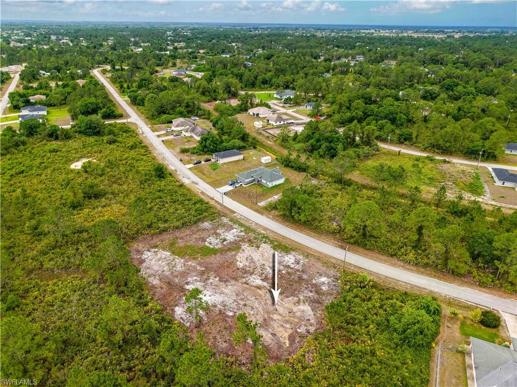View of property location featuring a heavily wooded area