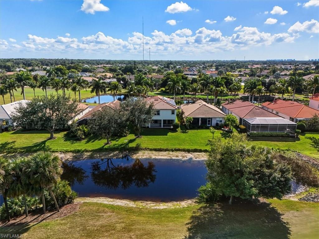 Aerial view of residential area featuring a large body of water