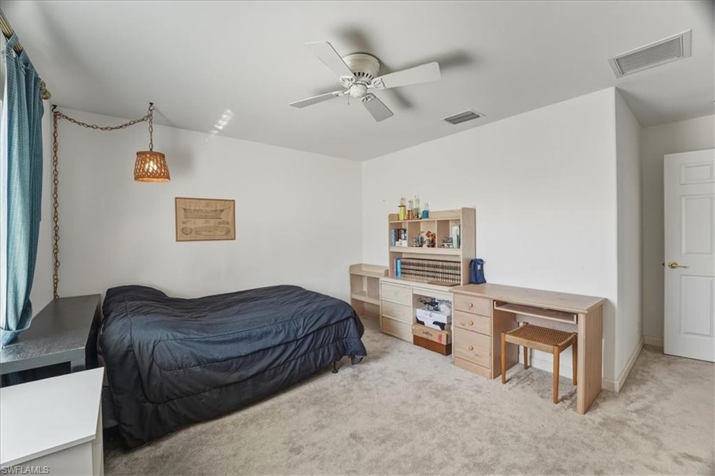 Bedroom featuring carpet floors and ceiling fan