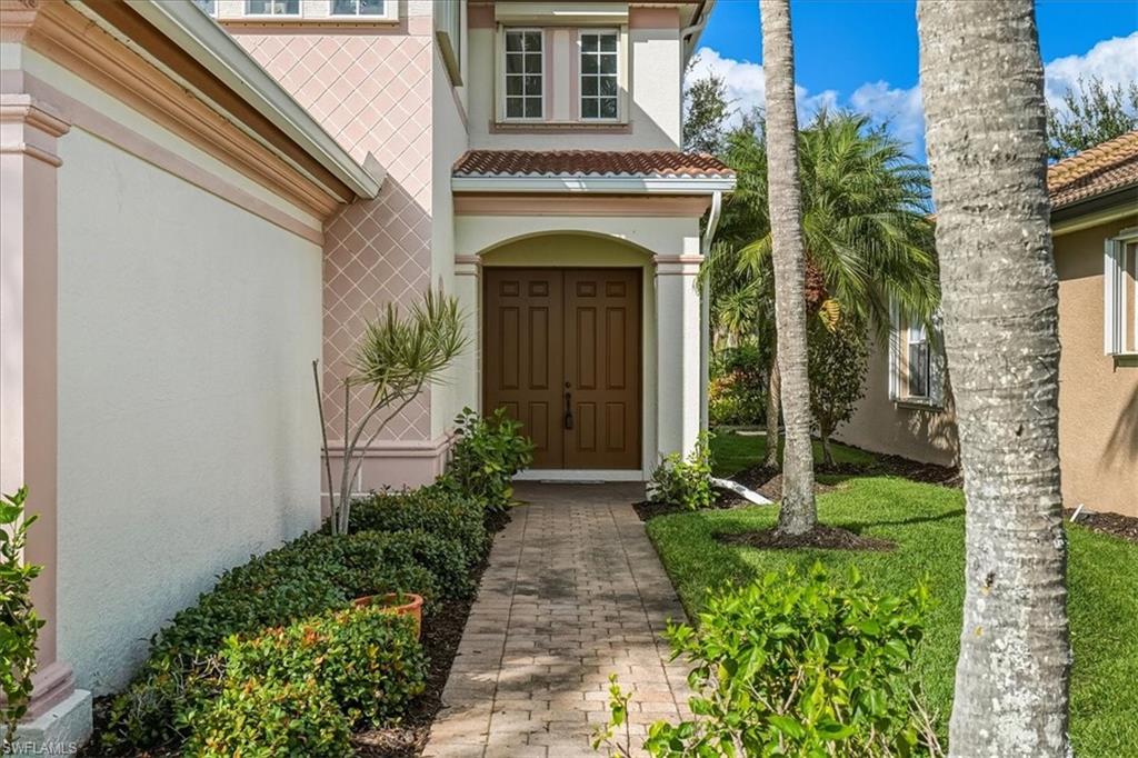 Property entrance with stucco siding
