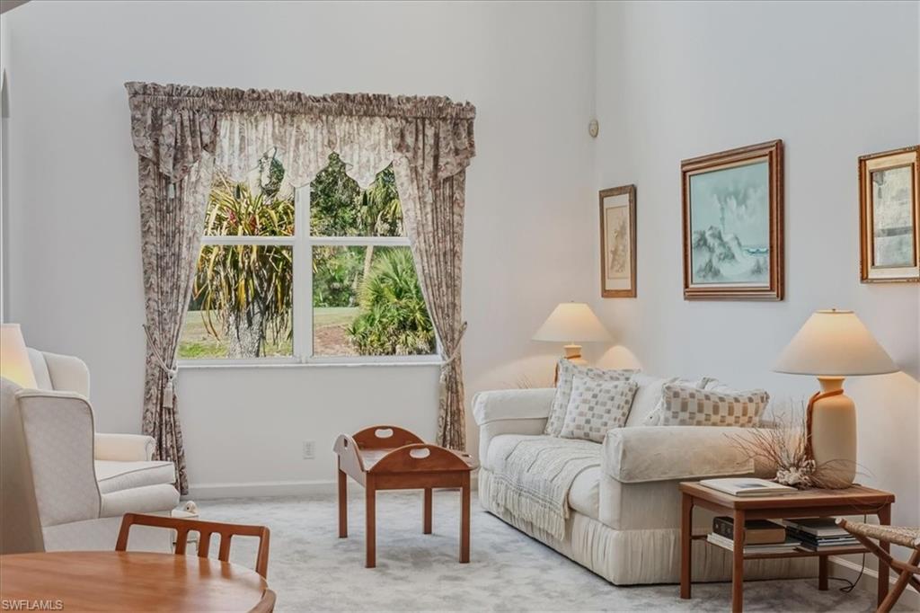 Sitting room with carpet and baseboards