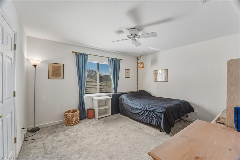 Bedroom with carpet floors and a ceiling fan