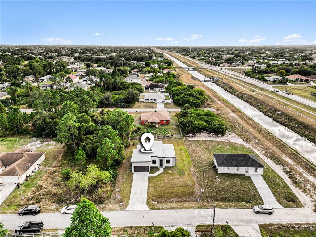 Aerial perspective of suburban area featuring a highway