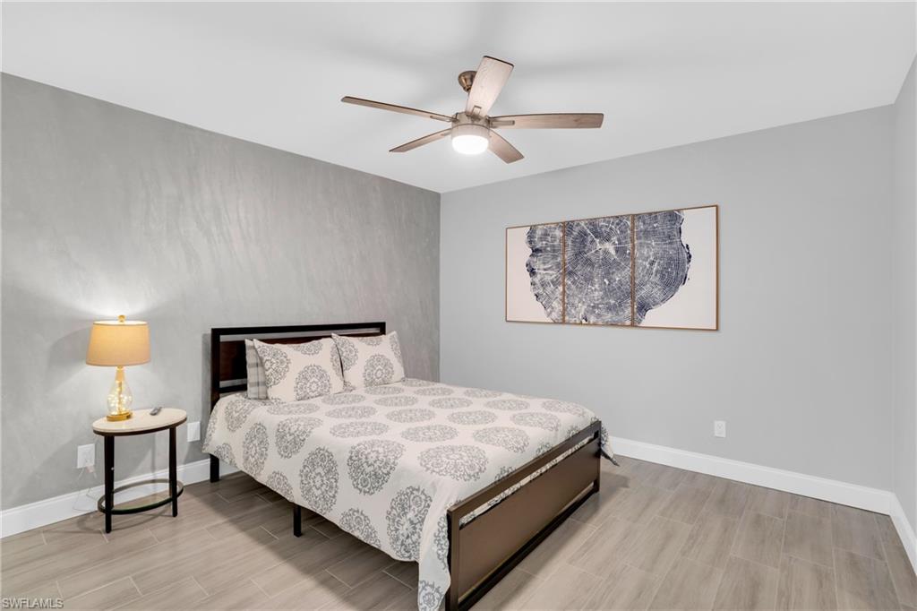 Bedroom featuring wood finish floors and a ceiling fan