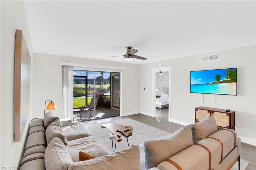 Living area featuring ceiling fan and light wood-style flooring