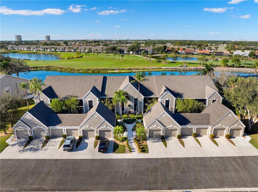 Aerial perspective of suburban area featuring a large body of water