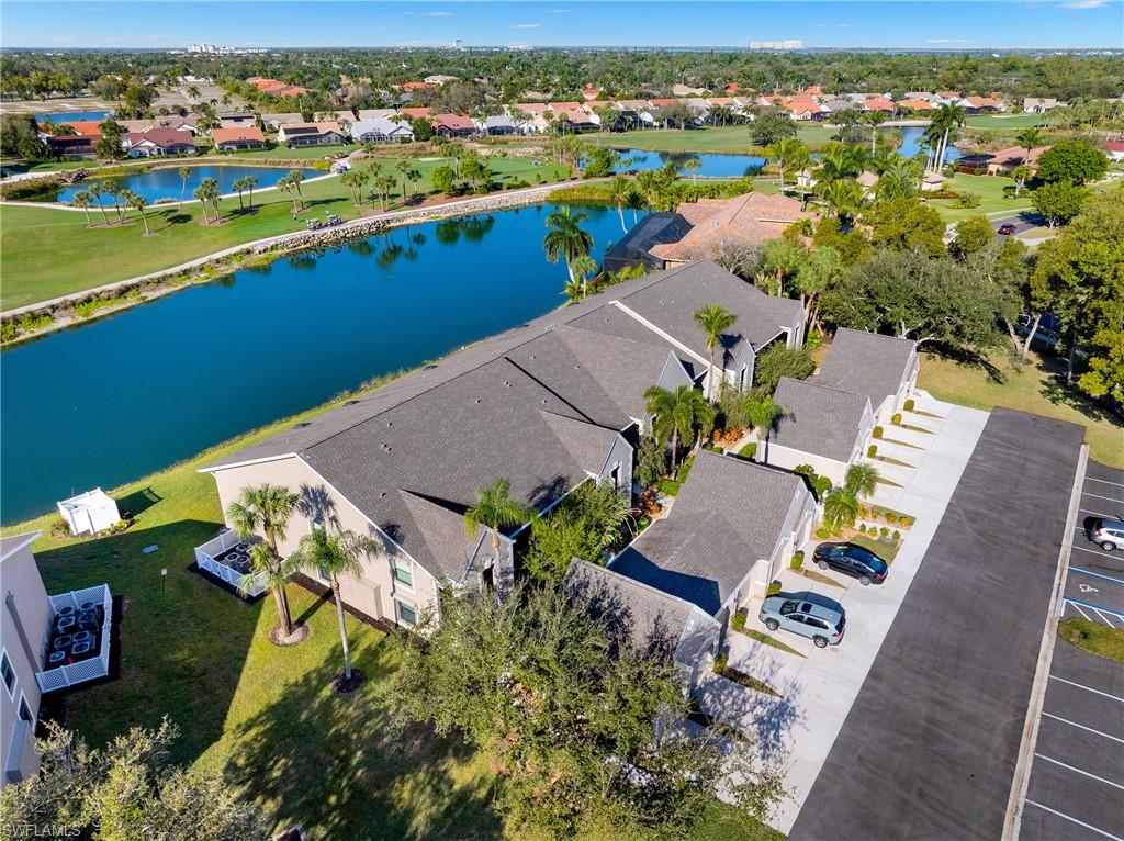 Aerial perspective of suburban area with a nearby body of water