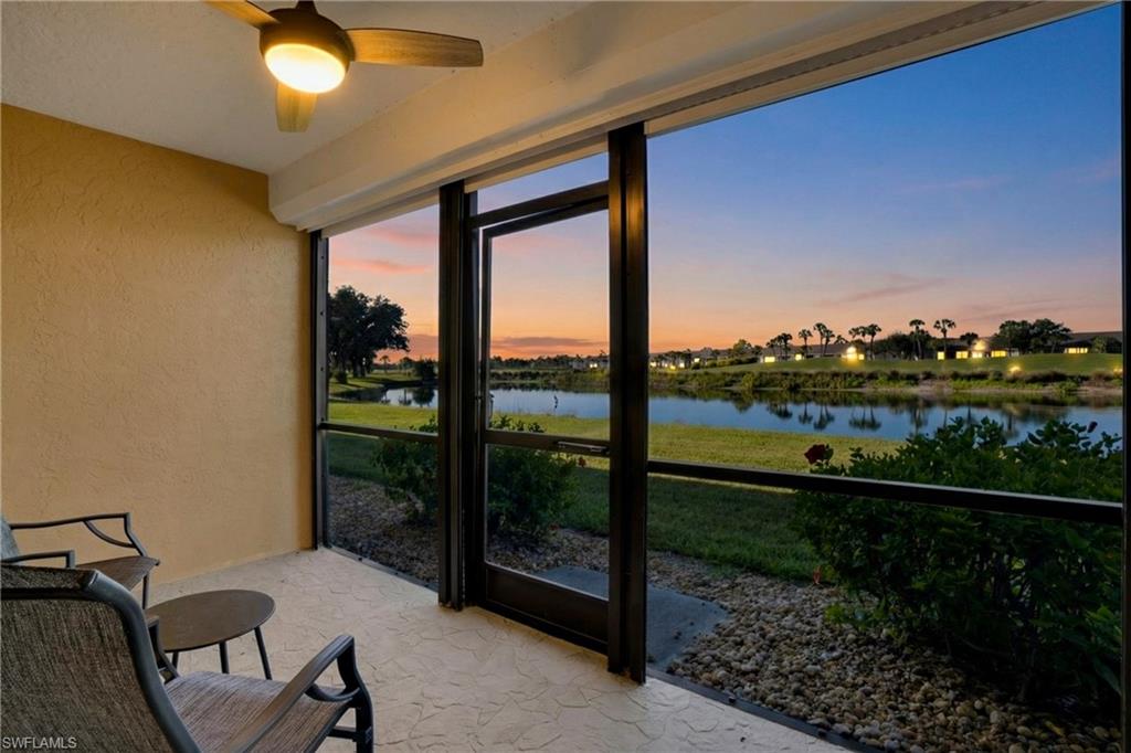Sunroom / solarium with a water view