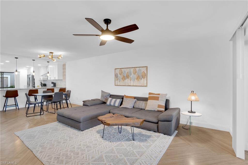 Living area featuring ceiling fan and recessed lighting