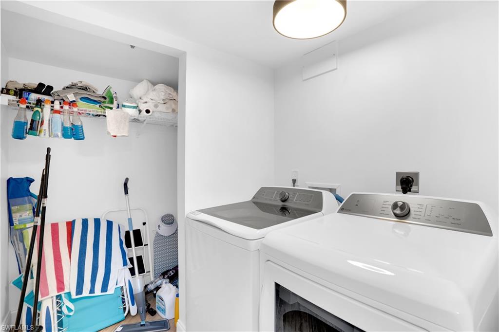 Washroom featuring washer and dryer