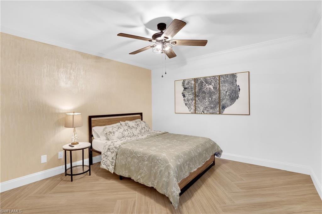 Bedroom with crown molding and ceiling fan