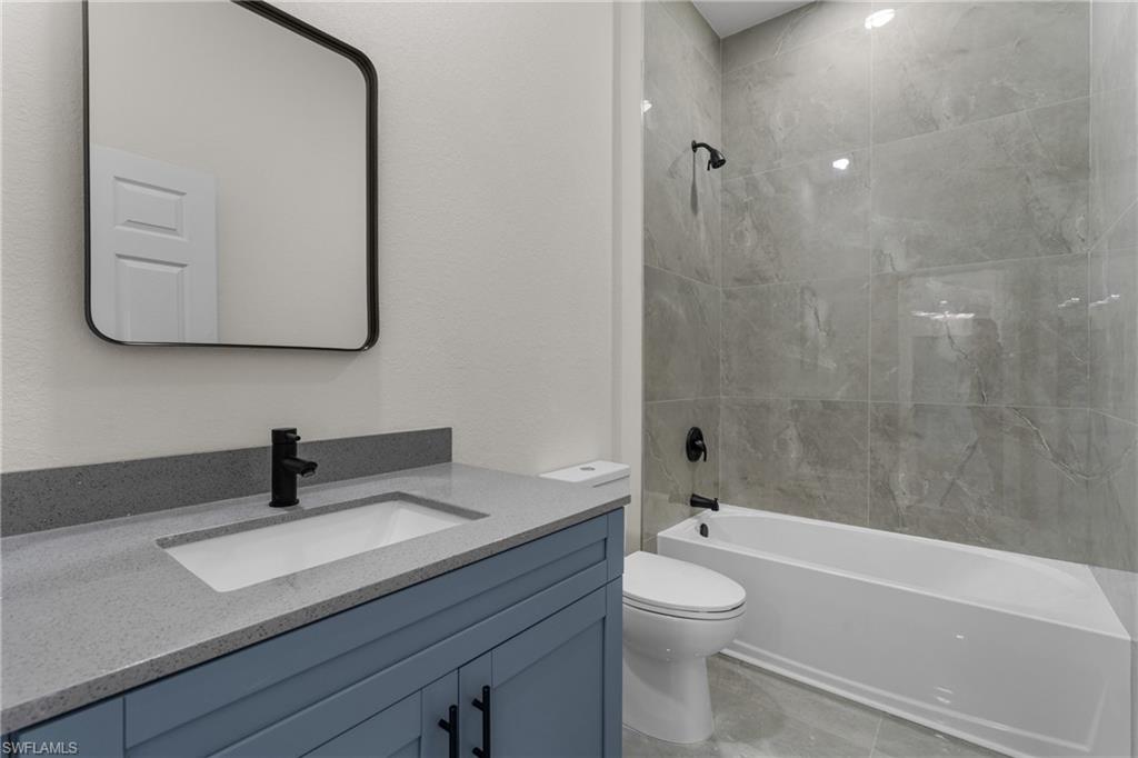 Full bathroom featuring bathing tub / shower combination and vanity
