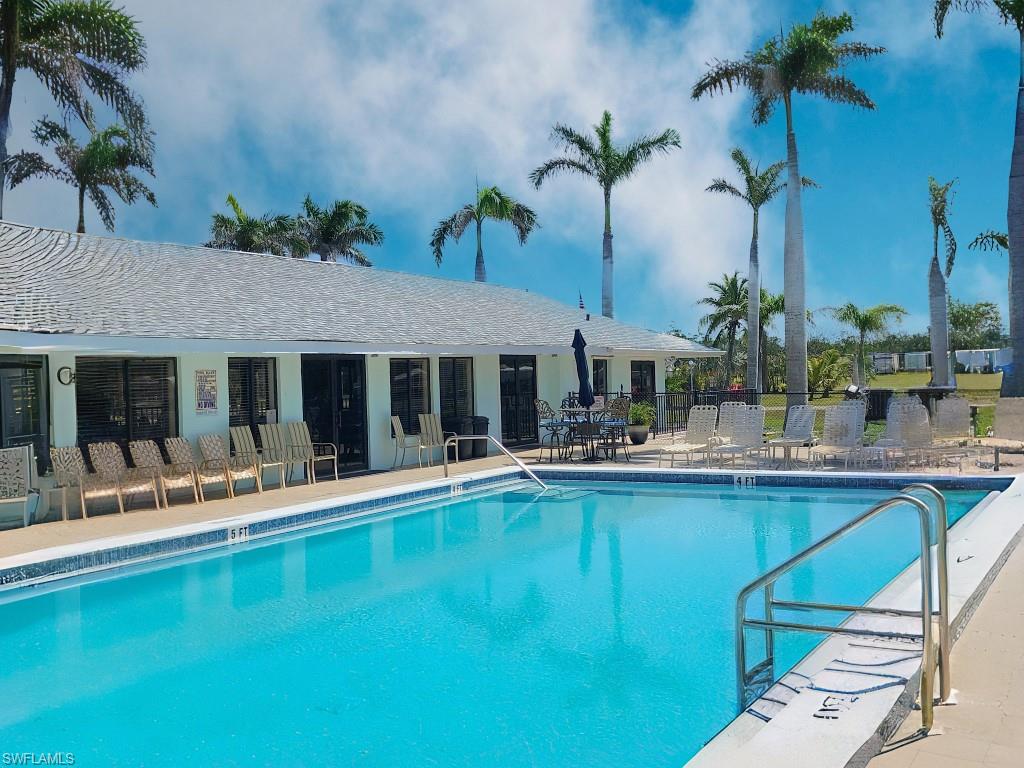 Community pool with a patio area