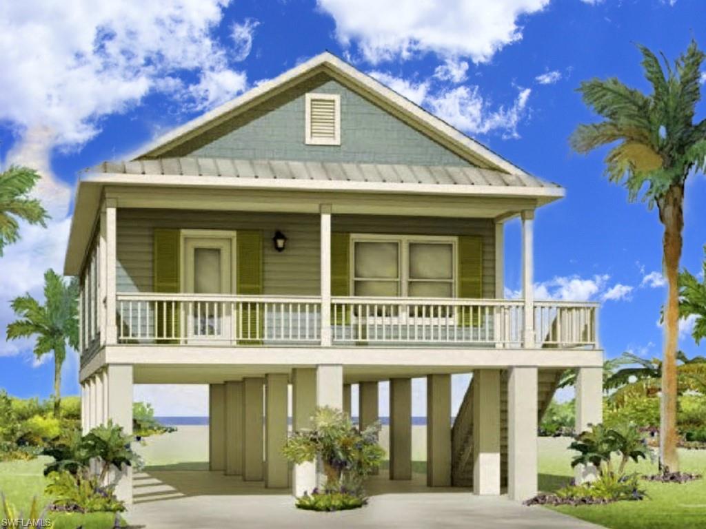 Raised beach house with a carport, a standing seam roof, a metal roof, and concrete driveway