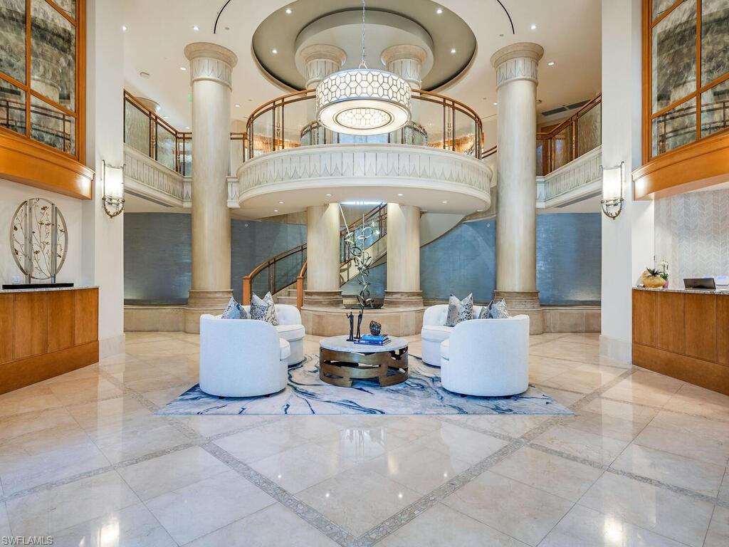 Lobby with a towering ceiling and recessed lighting