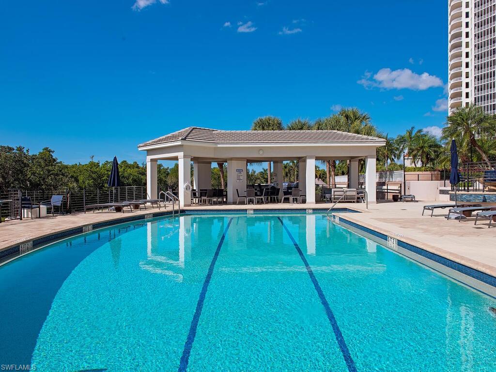 Community pool featuring a patio