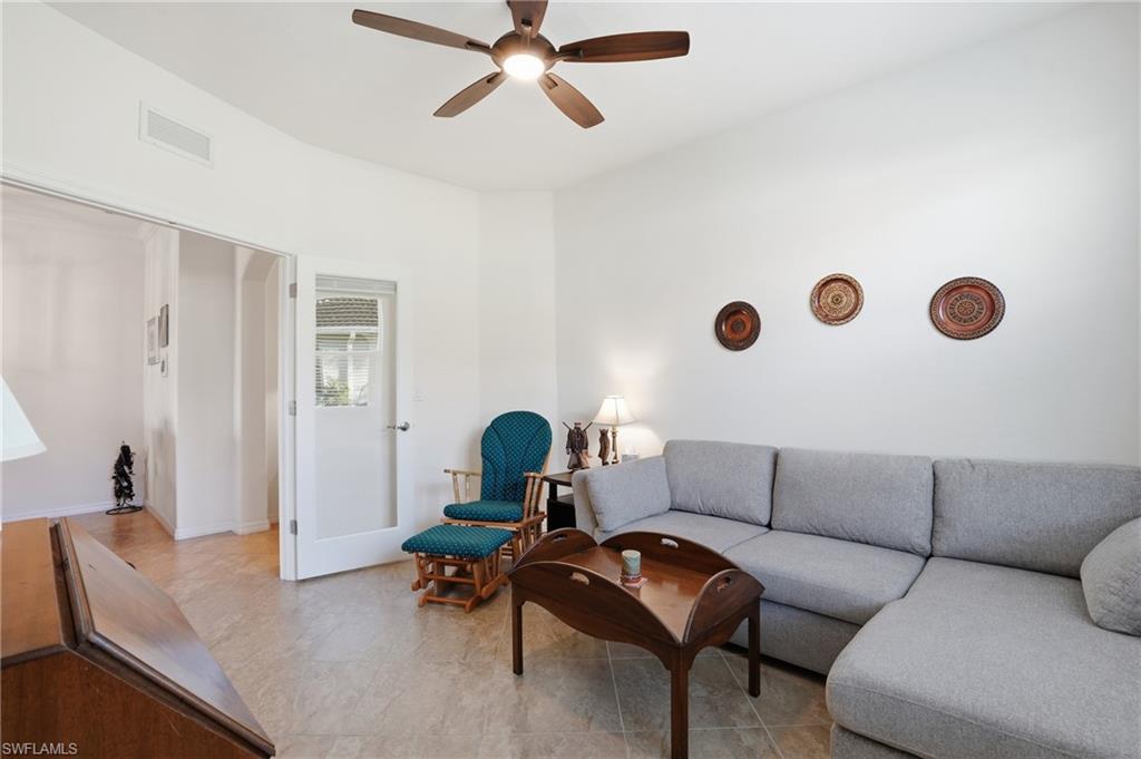 Living room featuring a ceiling fan