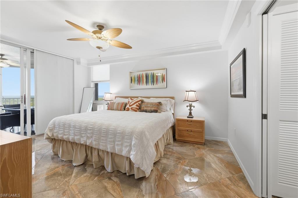 Bedroom featuring access to outside, ornamental molding, a ceiling fan, and floor to ceiling windows
