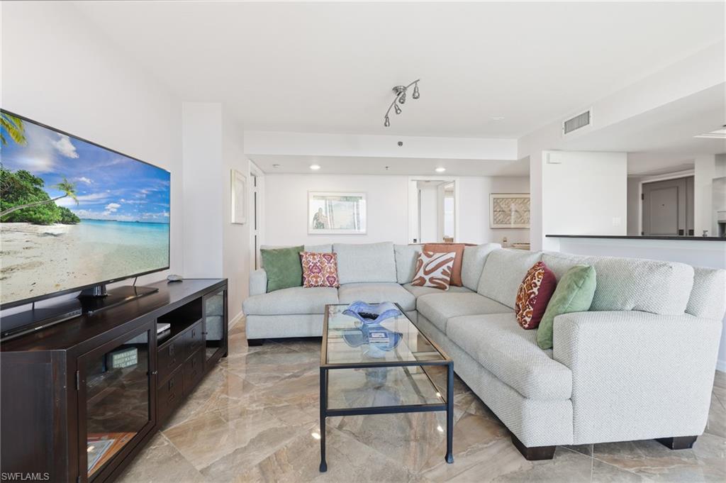 Living area featuring light marble finish flooring