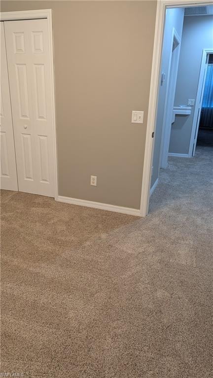 Unfurnished room featuring carpet floors